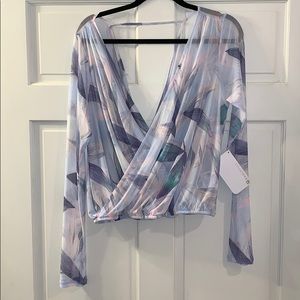 Fabletics “Treva” top. NWT. Sheer low “V” athletic